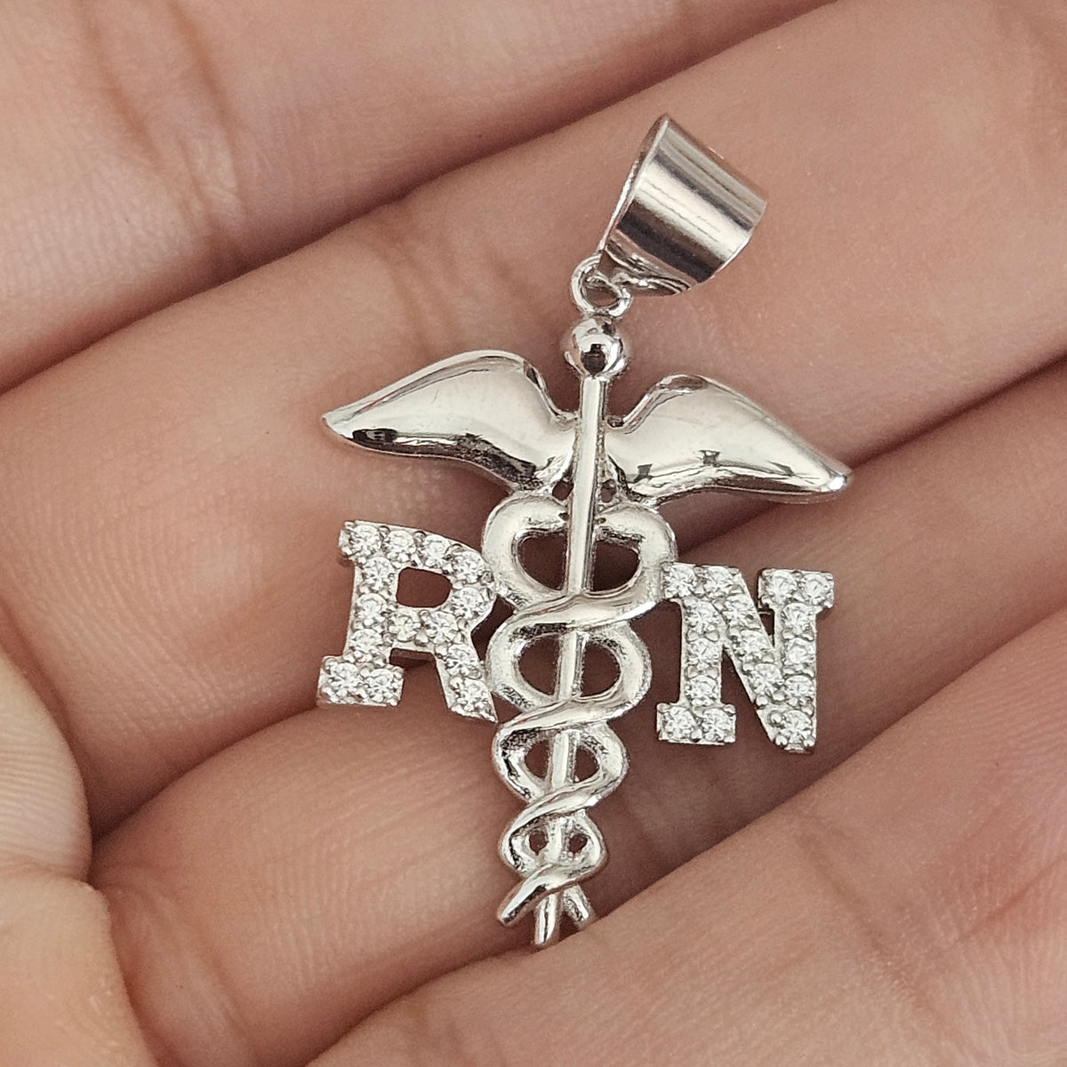 RN Silver Pendant with White Cubic Zirconia Stones